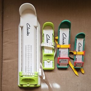 Clarks Shoe Measuring Tools in White, Green, and Red